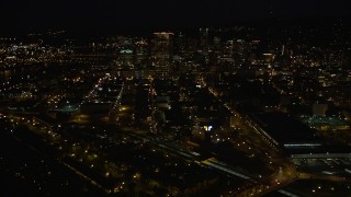 AX55_052 - 5K aerial stock footage of approaching US Bancorp Tower from Union Station, Downtown Portland, Oregon, night