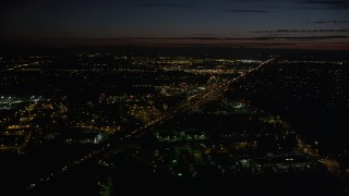 AX55_065 - 5K aerial stock footage of approaching Highway 26, Beaverton, Oregon, night