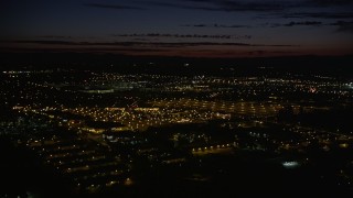 AX55_069 - 5K aerial stock footage pan across Intel Ronler Acres and office buildings, HIllsboro, Oregon, night