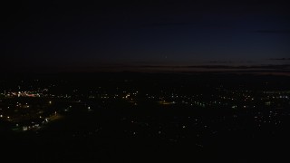 AX55_072 - 5K aerial stock footage of approaching Hillsboro Airport, Hillsboro, Oregon, night