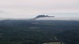 AX56_037 - 5K aerial stock footage of Saddle Mountain, evergreen forest and logging areas in Clatsop County, Oregon