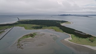 AX56_081 - 5K aerial stock footage approach Clatsop Spit, Oregon beside the Columbia River