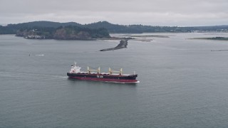 AX56_085 - 5K aerial stock footage track oil tanker on the Columbia River near Cape Disappointment, Washington