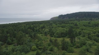 AX56_103 - 5K aerial stock footage fly over Cape Disappointment State Park toward North Head Light, Ilwaco, Washington