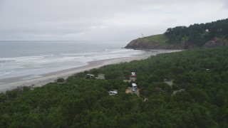 AX56_105 - 5K aerial stock footage fly over Cape Disappointment State Park, reveal empty beach near North Head Light, Ilwaco, Washington