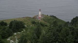 AX56_114 - 5K aerial stock footage flyby North Head Light, overlooking the Pacific Ocean in Ilwaco, Washington
