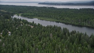 AX56_146 - 5K aerial stock footage approach lakeside homes with docks on Loomis Lake, Washington