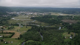 AX56_174E - 5K aerial stock footage of small town of Raymond, Washington beside the Willapa River
