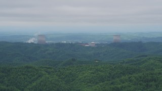 AX57_004 - 5K aerial stock footage of a view of the Satsop Nuclear Power Plant cooling towers, Satsop, Washington