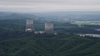 AX57_012E - 5K aerial stock footage of two cooling towers at the Satsop Nuclear Power Plant, Satsop, Washington