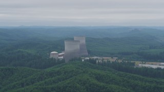 AX57_013 - 5K aerial stock footage of two cooling towers at the Satsop Nuclear Power Plant, Satsop, Washington