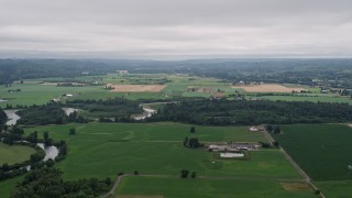 AX57_017 - 5K aerial stock footage of farms and crop fields in Satsop, Washington