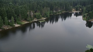 AX58_036 - Aerial stock footage of 5K aerial  video of lakeside homes by Stansberry Lake in Gig Harbor, Washington