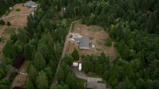 AX58_045E - 5K aerial stock footage tilt from rural homes to approach marsh in Burley Lagoon, Gig Harbor, Washington