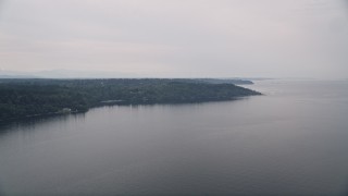 AX58_065 - 5K aerial stock footage fly away from Vashon Island, seen from Puget Sound, Washington