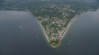 AX58_067 - 5K aerial stock footage approach the waterfront community of Burien, Washington from Puget Sound