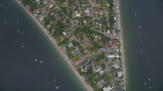 AX58_068 - 5K aerial stock footage of bird's eye view of waterfront homes on the shore of Puget Sound in Burien, Washington