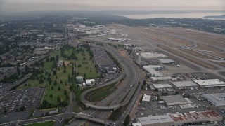 AX58_073 - 5K aerial stock footage of light traffic on Airport Expressway by Seattle Tacoma International Airport, Seattle, Washington