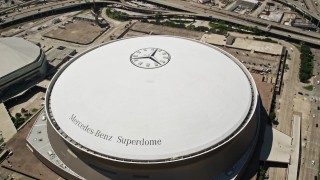 AX59_019 - 5K aerial stock footage approach the Mercedes-Benz Superdome, Downtown New Orleans, Louisiana