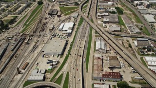 AX59_020 - 5K aerial stock footage of light traffic on the I-10 / Highway 90 interchange in Mid-City New Orleans, Louisiana