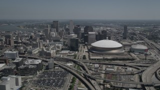 AX59_021 - 5K aerial stock footage of Downtown New Orleans skyscrapers and the Mercedes-Benz Superdome, Louisiana