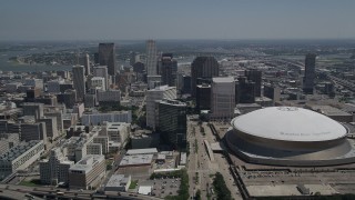 AX59_022 - 5K aerial stock footage approach Downtown New Orleans skyscrapers and Mercedes-Benz Superdome, Louisiana