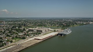 AX59_046 - 5K aerial stock footage of two military transport ships docked at Bywater, New Orleans, Louisiana