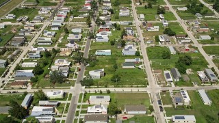 AX59_057E - 5K aerial stock footage fly over rows of homes in Lower Ninth Ward, New Orleans, Louisiana