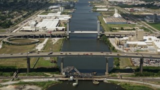 AX59_061 - 5K aerial stock footage of I-10 High Rise Bridge and Danziger Bridge spanning Industrial Canal, New Orleans, Louisiana
