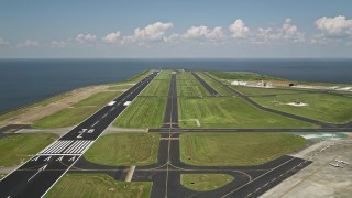 AX59_066 - 5K aerial stock footage of runways and control tower at the New Orleans Lakefront Airport, Louisiana