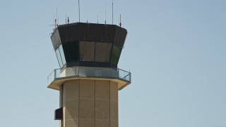 AX59_068 - 5K aerial stock footage approach the control tower at New Orleans Lakefront Airport, Louisiana