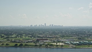AX60_001 - 5K aerial stock footage of Downtown New Orleans skyline seen from Lake Pontchartrain, Louisiana
