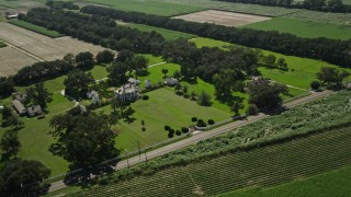 AX60_024 - 5K aerial stock footage of the Evergreen Plantation house and grounds in Edgard, Louisiana