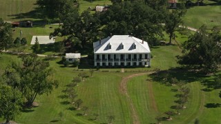 AX60_044E - 5K aerial stock footage of St. Joseph Plantation house and grounds in Vacherie, Louisiana