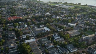 AX61_007 - 5K aerial stock footage fly over an urban neighborhood at sunset in Algiers, Louisiana