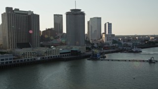 AX61_009 - 5K aerial stock footage flyby riverfront skyscrapers at sunset in Downtown New Orleans, Louisiana