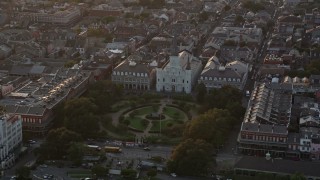 AX61_040E - 5K aerial stock footage orbit St. Louis Cathedral and Jackson Square at sunset in the French Quarter, New Orleans, Louisiana