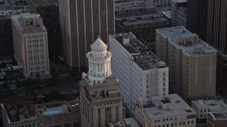 AX61_045 - 5K aerial stock footage approach the tower atop the Hibernia Bank building at sunset, Downtown New Orleans, Louisiana