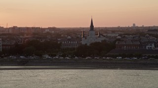 AX61_055 - 5K aerial stock footage of St. Louis Cathedral at sunset in the French Quarter of New Orleans, Louisiana