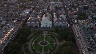 AX61_058 - 5K aerial stock footage fly over Jackson Square to approach St. Louis Cathedral at sunset, French Quarter, New Orleans, Louisiana