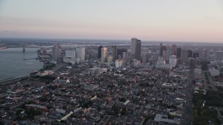 AX61_062 - 5K aerial stock footage of a view across the French Quarter at Downtown New Orleans at sunset, Louisiana