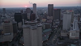 AX61_074 - 5K aerial stock footage fly west over Downtown New Orleans at sunset, Louisiana
