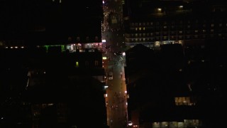 AX62_022 - 5K aerial stock footage of bird's eye view of a crowd on Bourbon Street in the French Quarter at night, New Orleans, Louisiana