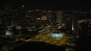 AX62_033 - 5K aerial stock footage of hotels around Harrah's in Downtown New Orleans at night, Louisiana