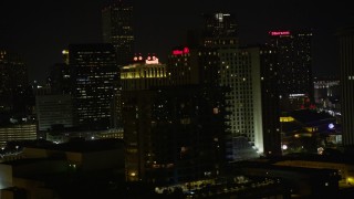 AX62_034 - 5K aerial stock footage flyby Harrah's and Hilton Riverside in Downtown New Orleans at night, Louisiana