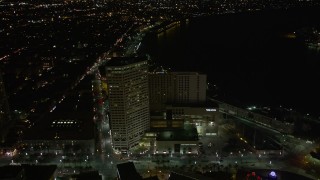 AX62_044 - 5K aerial stock footage fly over Harrah's and The Westin Canal Place to approach French Quarter at night, Louisiana