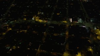 AX62_046 - 5K aerial stock footage urban homes around St. Claude Avenue and Elysian Fields Avenue at night, Gentilly New Orleans, Louisiana