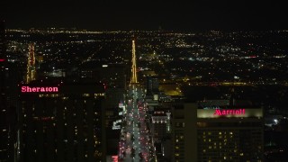 AX63_018E - 5K aerial stock footage pan across Downtown New Orleans at night, revealing Canal Street, Louisiana