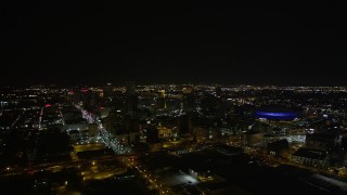AX63_028 - 5K aerial stock footage of a wide view of Downtown New Orleans at night, Louisiana