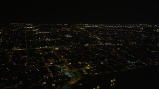 AX63_043 - 5K aerial stock footage of neighborhoods in the Upper Ninth Ward at night, New Orleans, Louisiana